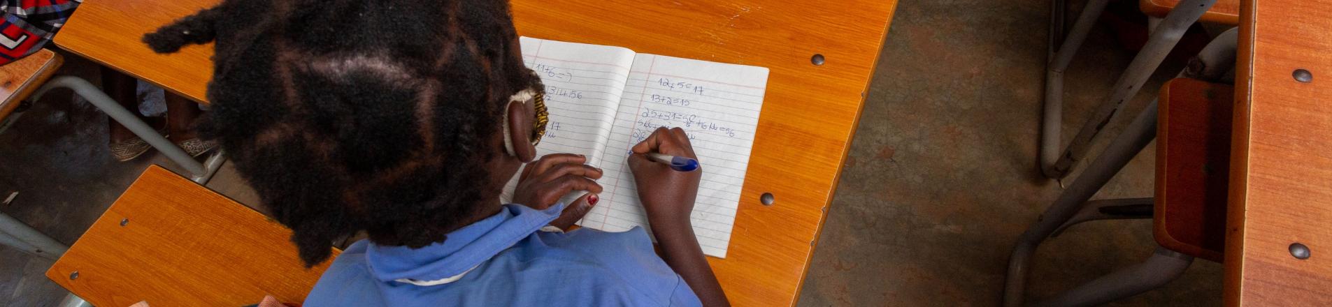 child reading in classroom