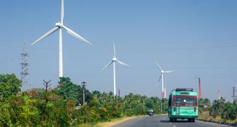 road and wind turbine in India