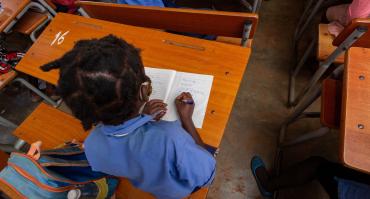 child reading in classroom