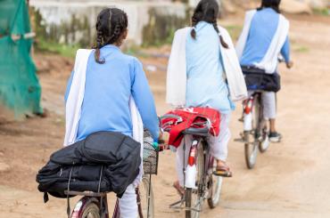Girls in India on bicycles