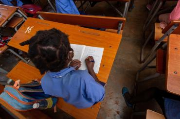 child reading in classroom